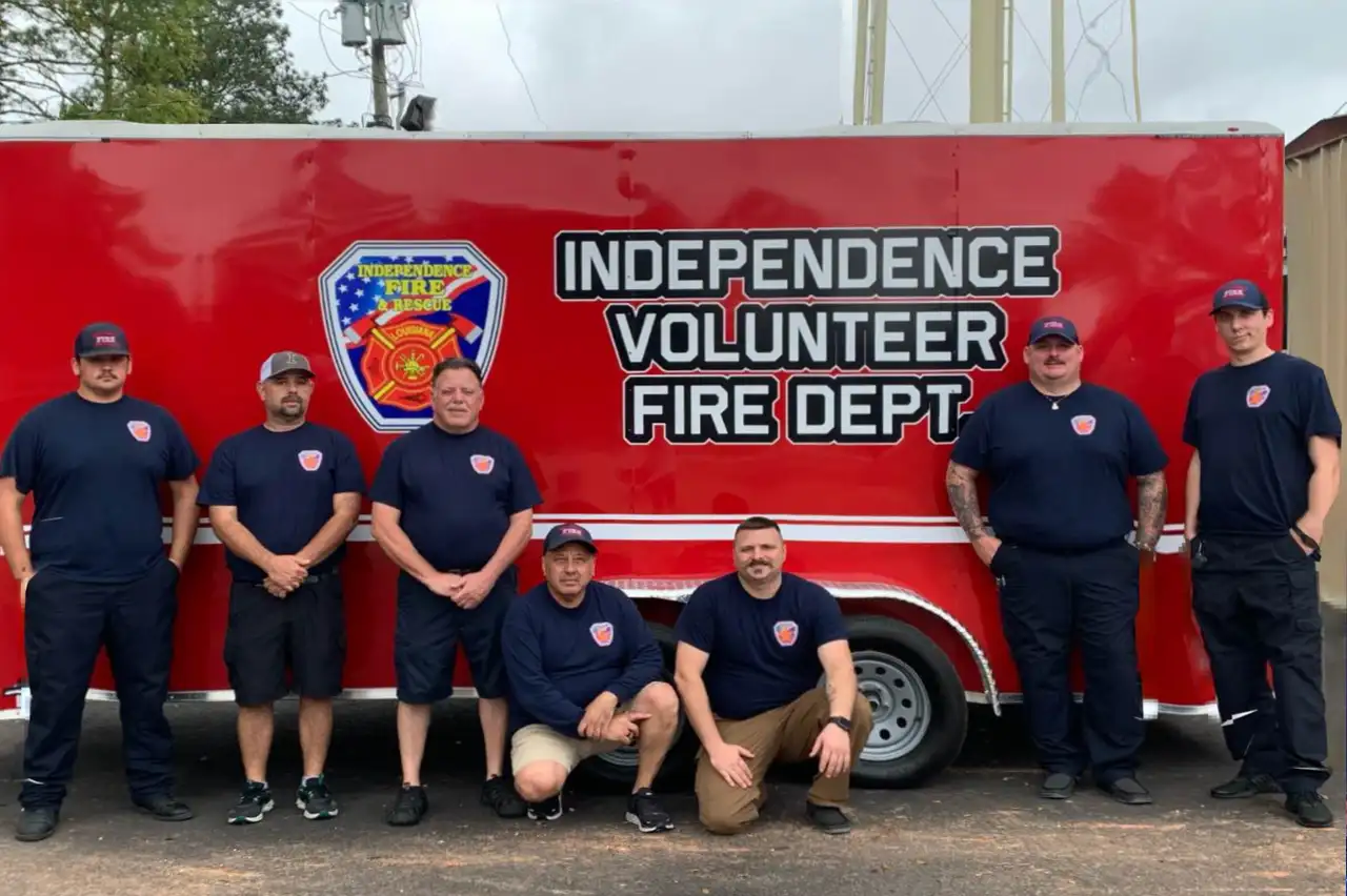 ivfd department members in front of trailer